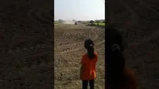 Laser guided land leveler in action.