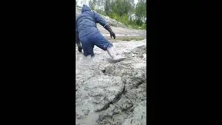 Rainwear, wellies and sticky clay mud