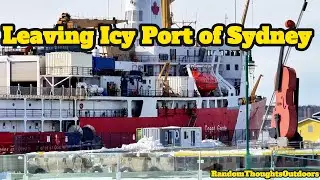 Coast guard ship breaking ice Leaving Port of Sydney, Nova Scotia Canada