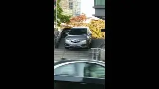 Woman Driving SUV Down Hotel Stairs in Vancouver