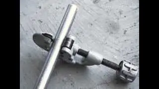 How to make a pipe curtain rod using a hand held pipe cutter via Funky Junk Interiors