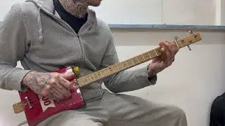 Dark western blues slide movie song oil can cigar box guitar
