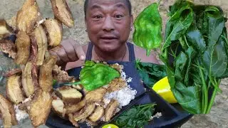 Eating Pork, kholar, passion fruit leaves and king chilli with rice