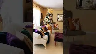 Christmas decor in gold, green, purple, cream in living room, including 2 trees