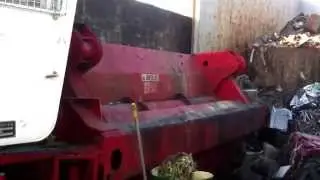 Sydney Metal Traders liebherr and hydraulic car compactor in action