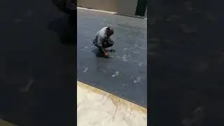 Polygomma EPDM waterproofing membrane being installed.