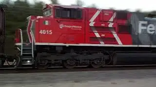 FXE 4015 (last unit) w/BNSF 7472 (waving crew) leading H-NTWKCK 10/26