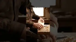 whittling a toy boat