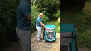 How to get the Burley Trailer top bar to click into position