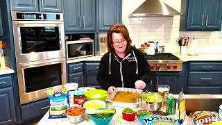 Aunt Peggy's 7-Layer Taco Dip #kathleenmadigan #katskitchen #appetizer #recipe #standupcomedy