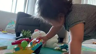 Baby playing with Vtech Turn & Learn and Musical Rhythm Story Book