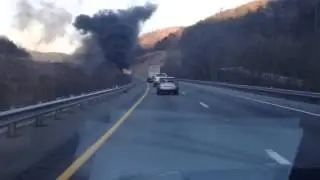 FedEx truck on fire on the side of I-81