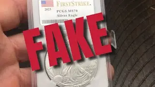 Осторожно! Поддельный американский серебряный орел в оправе MS70 PCGS — обратите внимание на эти ...