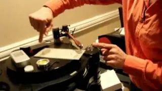 Stereo Times CES 2012: The Lotus Group setting up a high-end vinyl rig!