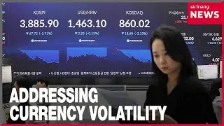 Finance minister answers questions on currency, trade with U.S., and stock investment