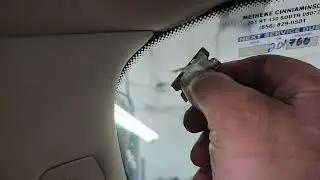 Previous oil sticker glue left on glass by other mechanics