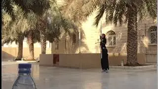 Arab Girl using Arrow for  Bottle Cap Challenge