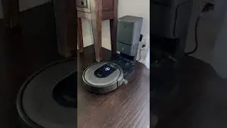 Just Roomba i8+ returning home and emptying the bin.