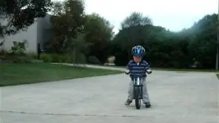 Thomas, a happy 2 year old riding his jd bug balance bike