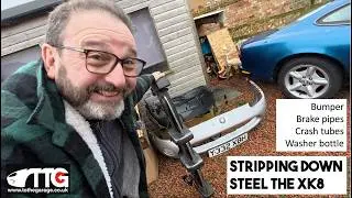 Bits coming off STEEL the Jaguar XK8 Coupe , Bumper, crash structures, Brake pipes, washer bottle