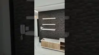 Alnoor tectile media wall with wall paper