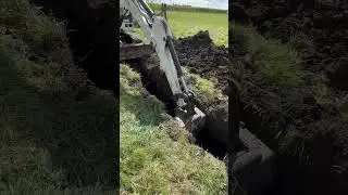 Bobcat 331 Mini Excavator digging a water line
