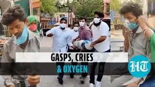 Watch: Man gasps for breath outside Delhi hospital, wife & son search for oxygen