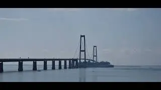 Star of the Seas passing under the Great Belt Bridge in Denmark