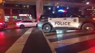Toronto Police Service' Cruisers responding on Lakeshore Blvd. In heavy traffic in downtown Toronto