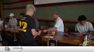 Iowa athletes sign autographs, raising money for two local causes