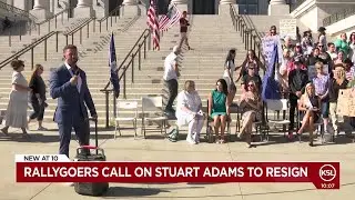 Rallygoers call on Stuart Adams to resign over claims he influenced law to help relative