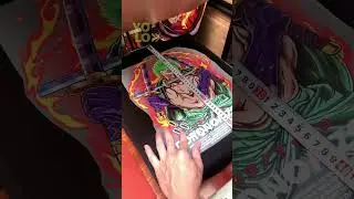 A DTF heat transfer printed T-shirt featuring the character Zoro from the anime series One Piece