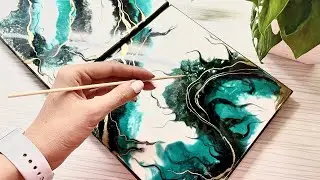 Interior painting in the technique of resin art. Turquoise and gold.