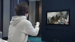 Asian young man is watching godtone serving hot pot