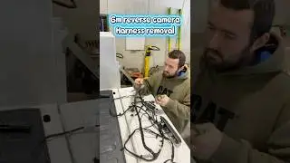 Pulling apart a gmc tailgate harness for a camera relocation on a utility body #gmc #work #truck