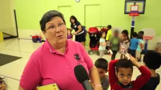 Becky Tooley Reads to Children at Discovery Preschool