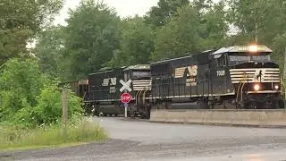 Rain + trains don't mix! NS EMD duo claws and nearly stalls pulling coal ash load up the branch.