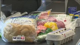 Last minute Christmas Eve shoppers check off grocery list