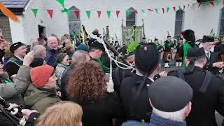 Dooagh Pipe Band playing the bagpipes on St Patrick's Day 2025 at Pollagh Church