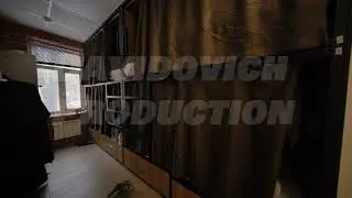 Hostel room interior showing bunk beds with curtains ensuring privacy