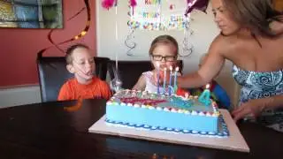 Amelia blowing out candles 4th birthday