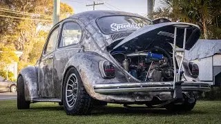 Heavily modified VW Beetle Rat Rod with Toyota 4K engine conversion lowered on muddies