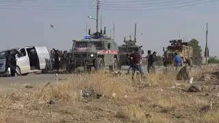Russian-Turkish Patrol Convoy Pelted With Stones In Syria