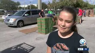 Volunteers help move thousands of Girl Scout cookies to local troops