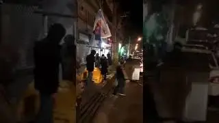 Iran-Tehran, 12 January 2020: Furious Protesters in Iran tearing down the poster of Qassem Soleimani