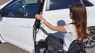 Beautiful Wheelchair Girl Transferring In and Out of the Car