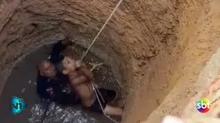 Police officers rescue boy who fell into a well while playing.