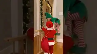Santa is chasing Elf with a gift