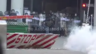 Police and protesters clash outside federal detention center in LA after ICE raids