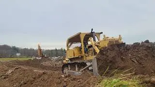 Dozer vs Rock Truck                                               Cat D8H and 735 Bulking Material